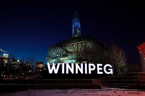 MIKE SUDOMA / WINNIPEG FREE PRESS
Hundreds of tea lights line the ledges in front of the Winnipeg sign at Scotia Bank Stage to commemorate the lives lost during the first year of the Covid 19 pandemic. The top of the Canada Museum for Human Rights tower will be lit up blue in tribute to the health care workers who have been on the frontlines of the pandemic. The memorial will be on display form March 11-14.
March 10, 2021