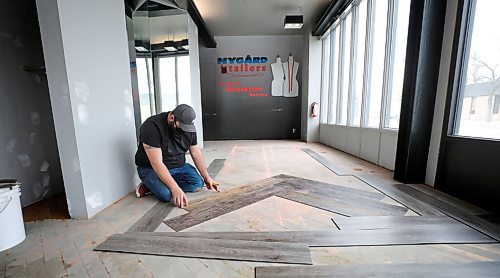 RUTH BONNEVILLE / WINNIPEG FREE PRESS 

Biz - Nygard store. changes to Total Flooring 

An installing contractor with Total Flooring lays flooring in a new design in the old tailor shop in the former Nygard fashion outlet space on Thursday. 

Brian Labossierre, with Total Flooring, is happy to take over the former Nygard Fashion outlet at 702 Broadway Ave., and transform it into their new location for Total Flooring.  

See Ben Waldman story. 

March 11 ,2021
