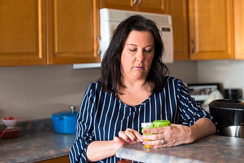 MIKAELA MACKENZIE / WINNIPEG FREE PRESS

Michelle Bailey, who is 51 and getting a covid vaccine next week as she is eligible due to underlying conditions, poses for a portrait with some of her medications in her home in Winnipeg on Friday, March 12, 2021. For Kevin Rollason story.

Winnipeg Free Press 2021