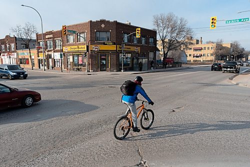 JESSE BOILY  / WINNIPEG FREE PRESS
A cyclist rides along Salter St. on Friday. With upcoming  construction on Salter in the North End coming, there currently are not any plans for bike lanes to be added. Friday, March 12, 2021.
Reporter: JS