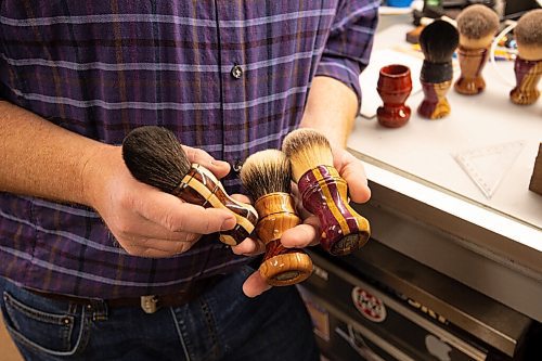 MIKE SUDOMA / WINNIPEG FREE PRESS
John Kydd, owner of Erebus and Terror Shaving Co., shows off three samples of his handmade shaving brushes inside his home workshop Sunday morning 
March 14, 2021