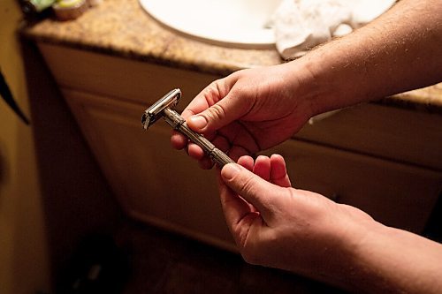 MIKE SUDOMA / WINNIPEG FREE PRESS
Stone Field Shaving Co owner, Jonathan Steinfeld holds up a razor out of his collection from the 1950s. The craftsmanship of the old style of razors is one of the factors that had gotten Steinfeld into collecting shaving memorabilia from years past.
March 12, 2021