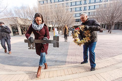 MIKE DEAL / WINNIPEG FREE PRESS
(from left): Andrée Forest, granddaughter of human rights crusader, Georges Forest and Alan Turner, son of the last mayor of St. Boniface, Ed Turner, deliver two art pieces: a large, stylized key and a wreath made of hundreds of keys to Winnipeg City Hall Monday morning.
St. Boniface residents are voicing their opposition to the sale of St. Boniface City Hall by delivering two art pieces: a large, stylized key and a wreath made of hundreds of keys representing the voices of residents who oppose the sale of the building located at 219 Provencher Blvd. Monday morning.
210315 - Monday, March 15, 2021.