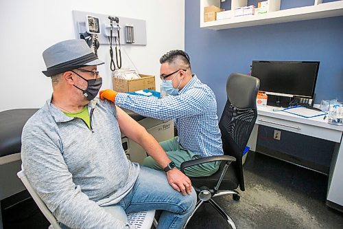 MIKAELA MACKENZIE / WINNIPEG FREE PRESS

Pharmacist Ryan Chan gives John Giavedoni an Oxford-AstraZeneca vaccine at the Exchange District Pharmacy in Winnipeg on Tuesday, March 16, 2021. For --- story.

Winnipeg Free Press 2021