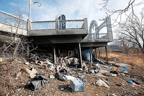 JOHN WOODS / WINNIPEG FREE PRESS
Squatter garbage is left under a walkway in St Vital along the Red River in Winnipeg Tuesday, March 16, 2021. A citizen complained to city and is concerned the garbage will end up in the river during spring runoff.

Reporter: ?