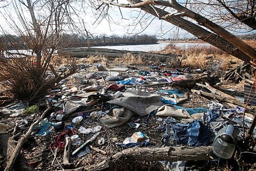 JOHN WOODS / WINNIPEG FREE PRESS
Squatter garbage is left under a walkway in St Vital along the Red River in Winnipeg Tuesday, March 16, 2021. A citizen complained to city and is concerned the garbage will end up in the river during spring runoff.

Reporter: ?