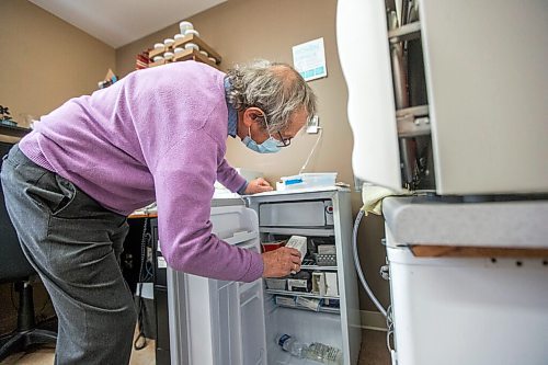 MIKAELA MACKENZIE / WINNIPEG FREE PRESS

Dr. Gerry Clayden looks in the fridge for the vials of the vaccine at Carman Medical Group in Carman on Wednesday, March 17, 2021. Dr. Clayden says that the eligibility criteria is too narrow. For Carol Sanders story.

Winnipeg Free Press 2021