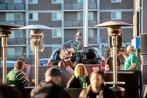 MIKE SUDOMA / WINNIPEG FREE PRESS 
Musician, Grant Leutschaft, entertains guests as they enjoy St Patricks Day at Fionns Grant Park Wednesday evening
March 17, 2021