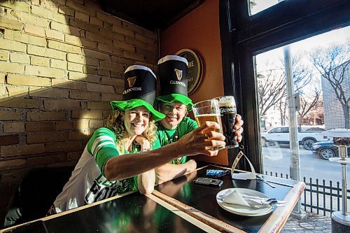 MIKE SUDOMA / WINNIPEG FREE PRESS 
Di and Jim McDougal cheers ice cold pints as they celebrate St Patricks Day at The Kings Head Wednesday evening
March 17, 2021