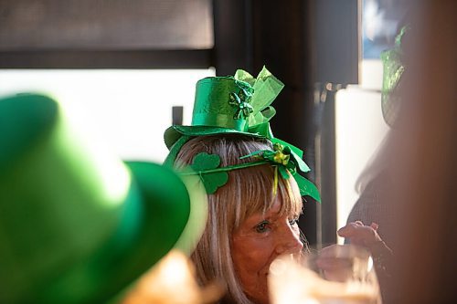 MIKE SUDOMA / WINNIPEG FREE PRESS 
Claire (last name with held) looking festive while enjoying a drink with her friends for St Patricks Day on the patio at Fionns Grant Park Wednesday evening
March 17, 2021