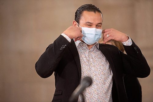 MIKE SUDOMA / WINNIPEG FREE PRESS 
NDP Leader, Was Kinew, takes off a disposable mask as he steps up to the podium to talk with media about the NDPs effort to delay the Conservatives Bill 16 during a press conference at the Manitoba Legislative Building Friday.
March 19, 2021