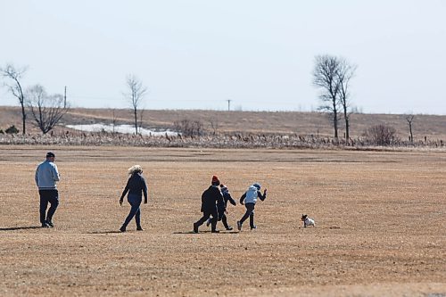 MIKE DEAL / WINNIPEG FREE PRESS
Scott Moore with wife Julia Allen and their children, Cole, 10, Davis, 8, and Luke, 6, with Rosie the dog at La Barriere park Friday afternoon.
210319 - Friday, March 19, 2021.