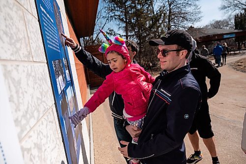 Daniel Crump / Winnipeg Free Press. Nick Sears holds Malaya as the two spend a day at the Assiniboine Park Zoo with extended family. March 20, 2021.