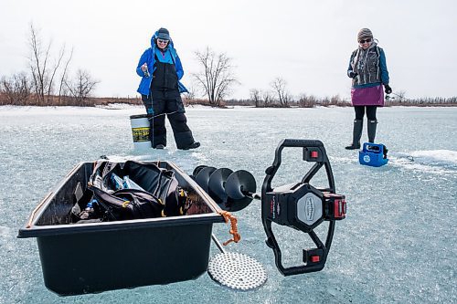Daniel Crump / Winnipeg Free Press. Roselle Turenne (left) and Lori Slobodian (right) chat as they fish on a lake at Fort Whyte Alive. Today is the warmest March 20 on record in Winnipeg. March 20, 2021.