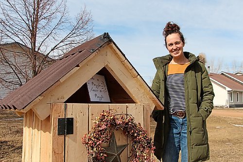 Canstar Community News Nicole Hyde stands by the puzzle library at 51 Rue Rocan in La Salle on March 15. Hyde has gone through many puzzles over the past several months and wanted a way to trade with neighbours. (GABRIELLE PICHÉ/CANSTAR COMMUNITY NEWS/HEADLINER)
