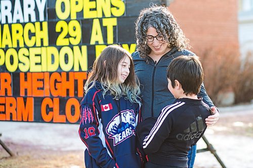 MIKAELA MACKENZIE / WINNIPEG FREE PRESS

Sara Robert and her kids, Elodie (nine) and Drew (seven), pose for a portrait at the closed River Heights Library in Winnipeg on Monday, March 22, 2021. For Jen Zoratti story.

Winnipeg Free Press 2021