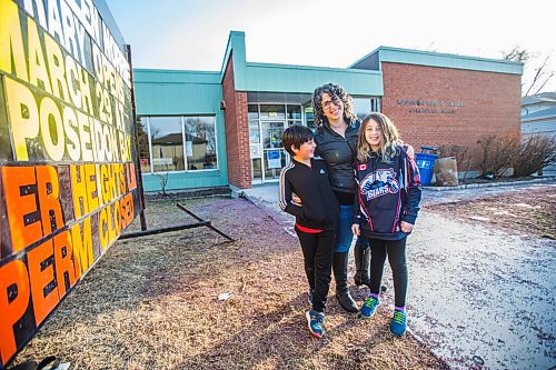 MIKAELA MACKENZIE / WINNIPEG FREE PRESS

Sara Robert and her kids, Elodie (nine) and Drew (seven), pose for a portrait at the closed River Heights Library in Winnipeg on Monday, March 22, 2021. For Jen Zoratti story.

Winnipeg Free Press 2021