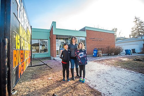 MIKAELA MACKENZIE / WINNIPEG FREE PRESS

Sara Robert and her kids, Elodie (nine) and Drew (seven), pose for a portrait at the closed River Heights Library in Winnipeg on Monday, March 22, 2021. For Jen Zoratti story.

Winnipeg Free Press 2021