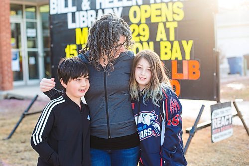 MIKAELA MACKENZIE / WINNIPEG FREE PRESS

Sara Robert and her kids, Elodie (nine) and Drew (seven), pose for a portrait at the closed River Heights Library in Winnipeg on Monday, March 22, 2021. For Jen Zoratti story.

Winnipeg Free Press 2021