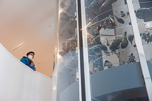 MIKE DEAL / WINNIPEG FREE PRESS
Normand Collet a friend of a donor to the WAG looks out at the open gallery from a balcony that wraps around the sculpture vault in the WAG's Quamajuq centre which opened for a sneak peek for donors and members in advance of the grand opening later this week.
210323 - Tuesday, March 23, 2021.