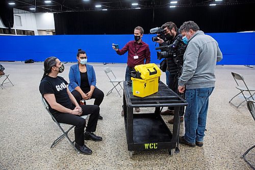 MIKE DEAL / WINNIPEG FREE PRESS
Pool and government media talk to Grand Chief Arlen Dumas after he received his COVID-19 immunization from Dr. Marcia Anderson, public health lead, First Nation Pandemic Response Coordination Team at the Vaccination Supercentre at the RBC Convention Centre Thursday morning.
210325 - Thursday, March 25, 2021.