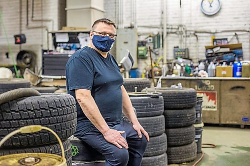 MIKAELA MACKENZIE / WINNIPEG FREE PRESS

Mike Timlick, owner of the Auto Centre on top of The Bay parking garage, poses for a portrait in the shop in Winnipeg on Thursday, March 25, 2021.  For Ben Waldman story.

Winnipeg Free Press 2021