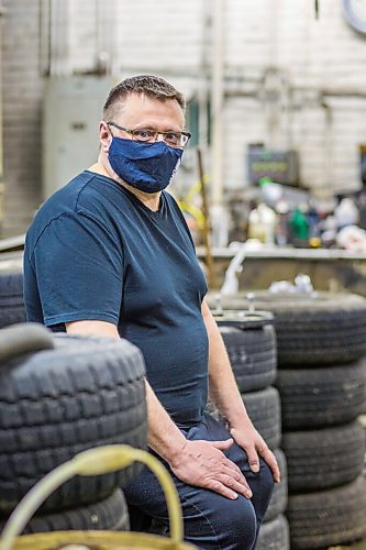 MIKAELA MACKENZIE / WINNIPEG FREE PRESS

Mike Timlick, owner of the Auto Centre on top of The Bay parking garage, poses for a portrait in the shop in Winnipeg on Thursday, March 25, 2021.  For Ben Waldman story.

Winnipeg Free Press 2021