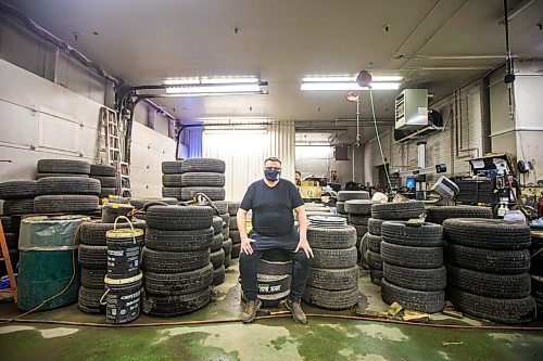 MIKAELA MACKENZIE / WINNIPEG FREE PRESS

Mike Timlick, owner of the Auto Centre on top of The Bay parking garage, poses for a portrait in the shop in Winnipeg on Thursday, March 25, 2021.  For Ben Waldman story.

Winnipeg Free Press 2021