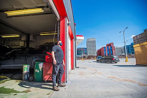 MIKAELA MACKENZIE / WINNIPEG FREE PRESS

Mike Timlick, owner of the Auto Centre on top of The Bay parking garage, poses for a portrait in the shop in Winnipeg on Thursday, March 25, 2021.  For Ben Waldman story.

Winnipeg Free Press 2021