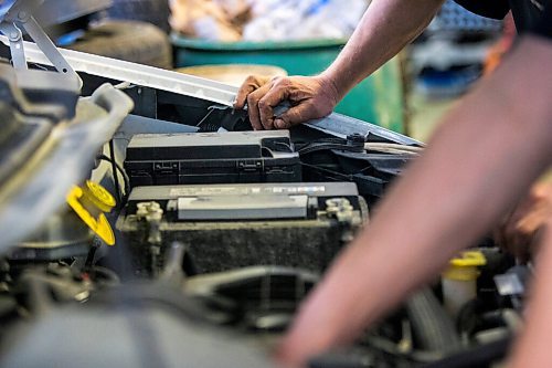 MIKAELA MACKENZIE / WINNIPEG FREE PRESS

Mechanic Ted Paszko (left) and Mike Timlick, owner of the Auto Centre, work on a car at the garage in Winnipeg on Thursday, March 25, 2021.  For Ben Waldman story.

Winnipeg Free Press 2021