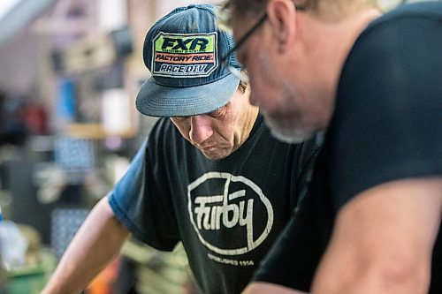 MIKAELA MACKENZIE / WINNIPEG FREE PRESS

Mechanic Ted Paszko (left) and Mike Timlick, owner of the Auto Centre, work on a car at the garage in Winnipeg on Thursday, March 25, 2021.  For Ben Waldman story.

Winnipeg Free Press 2021