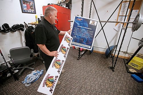 JOHN WOODS / WINNIPEG FREE PRESS
Ken Pearson, Neepawa Native head coach and GM, looks at old signage which has been removed in the players weight room at Yellowhead Centre arena in Neepawa Thursday, March 25, 2021. The Natives are planning a name change.


Reporter: Sawatzky