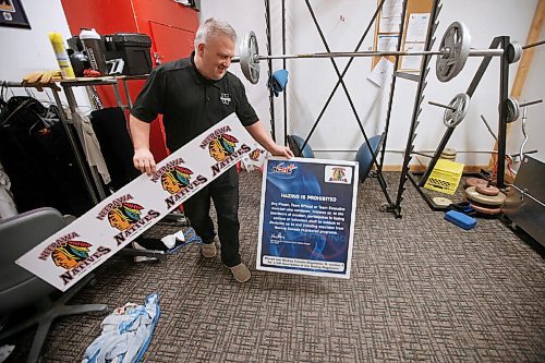 JOHN WOODS / WINNIPEG FREE PRESS
Ken Pearson, Neepawa Native head coach and GM, looks at old signage which has been removed in the players weight room at Yellowhead Centre arena in Neepawa Thursday, March 25, 2021. The Natives are planning a name change.


Reporter: Sawatzky