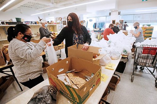 JOHN WOODS / WINNIPEG FREE PRESS
Amanda Naughton-Gale, centre, Community Ministries Director at Salvation Army in Neepawa, works with volunteers to make 1300 Spring Break Snack Packs for Neepawa children in the thrift shop Thursday, March 25, 2021. Naughton-Gale organized a campaign to get the Neepawa Natives to change their team nickname. The Natives organization is planning a name change.

Reporter: Sawatzky