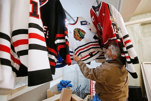 JOHN WOODS / WINNIPEG FREE PRESS
Dave McIntosh, a business owner in Neepawa, looks through his Neepawa Natives jersey collection in his basement, Thursday, March 25, 2021. McIntosh was a driving force behind the Neepawa Natives organization for years. The Natives organization are planning a name change.

Reporter: Sawatzky