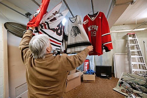 JOHN WOODS / WINNIPEG FREE PRESS
Dave McIntosh, a business owner in Neepawa, looks through his Neepawa Natives jersey collection in his basement, Thursday, March 25, 2021. McIntosh was a driving force behind the Neepawa Natives organization for years. The Natives organization are planning a name change.

Reporter: Sawatzky