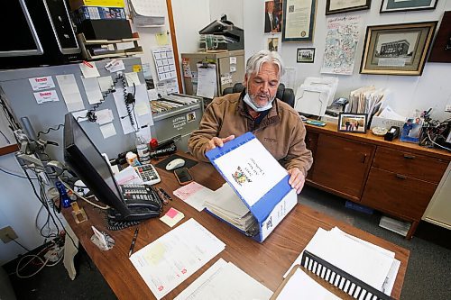 JOHN WOODS / WINNIPEG FREE PRESS
Dave McIntosh, a business owner  in Neepawa, looks through binders of Neepawa Natives information in his office Thursday, March 25, 2021. McIntosh was a driving force behind the Neepawa Natives organization for years. The Natives organization are planning a name change.

Reporter: Sawatzky