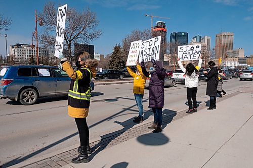 Daniel Crump / Winnipeg Free Press. Hundreds of people take part in an anti asian hate vehicle rally in front of the Canadian Museum for Human Rights at the Forks in downtown Winnipeg. While most people circle Israel Asper Way and Waterfront Drive in vehicles, some also line the sidewalks with signs. Almost all carry a yellow ribbon. The event was organized by Women of Colour Community Leadership initiative Manitoba and the Manitoba Chinese Family Centre. March 27, 2021.
