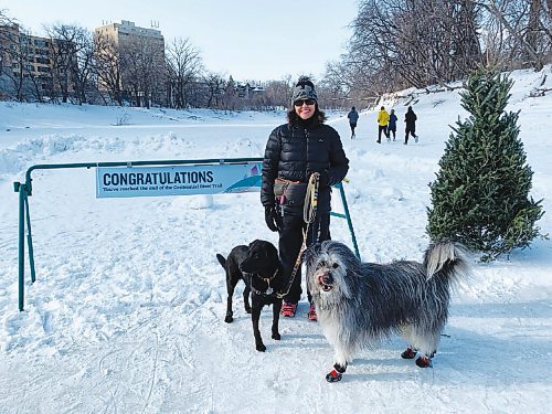 Canstar Community News Vicki Magnifico at the end of the Winnipeg Foundation Centennial River Trail with dogs Maggie (black) and Mighty (grey/white/black).
