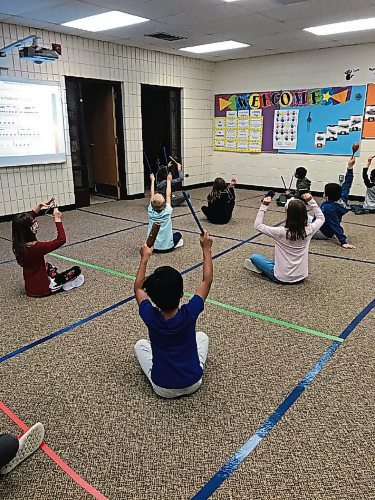 Canstar Community News Early years students at Bernie Wolfe Community School (95 Bournais St.) practice social distancing in their first music class of the year. (SHELDON BIRNIE/CANSTAR/THE HERALD)