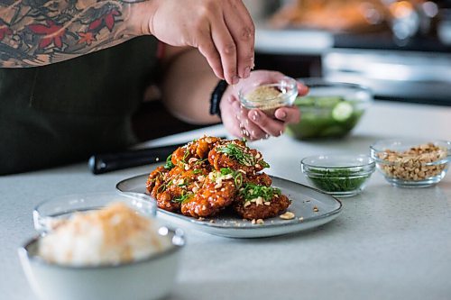 MIKAELA MACKENZIE / WINNIPEG FREE PRESS
Chef Mark Merano plates Korean fried chicken at home in Winnipeg on Monday, March 29, 2021. For Eva Wasney story.
Winnipeg Free Press 2021