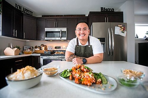 MIKAELA MACKENZIE / WINNIPEG FREE PRESS

Chef Mark Merano poses with his Korean fried chicken at home in Winnipeg on Monday, March 29, 2021.  For Eva Wasney story.

Winnipeg Free Press 2021