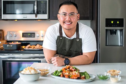 MIKAELA MACKENZIE / WINNIPEG FREE PRESS

Chef Mark Merano poses with his Korean fried chicken at home in Winnipeg on Monday, March 29, 2021.  For Eva Wasney story.

Winnipeg Free Press 2021