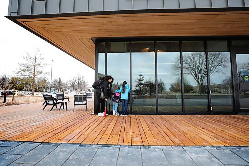 RUTH BONNEVILLE / WINNIPEG FREE PRESS 

standup - New Bill and Helen Norrie Library 

A family peers through the windows of the new Library from the outdoor patio deck.  

The City of Winnipeg officially opened the new Bill and Helen Norrie Library (15 Poseidon Bay) to replace the former River Heights Library. 

Named after former mayor Bill Norrie and his wife Helen Norrie, who worked as a teacher/librarian in public schools in Winnipeg, the new 14,000 square foot facility will better meet the needs of the community, offering a fully accessible multi-use public space, tutorial and programming rooms, improved study and leisure areas, and a 24/7 book return chute.

Note: The  Library is only open for pick up and drop off at this time due to provincial COVID restrictions.

March 29 ,2021

