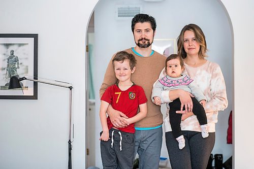 MIKAELA MACKENZIE / WINNIPEG FREE PRESS

Zeke Beilfuss (five, left), Rodrigo Beilfuss, Indira Beilfuss (nine months), and Elizabeth Holl pose for a portrait in their home in Winnipeg on Tuesday, March 30, 2021.  For Sarah story.

Winnipeg Free Press 2021