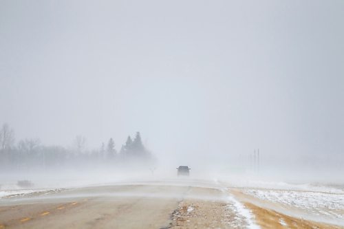 MIKAELA MACKENZIE / WINNIPEG FREE PRESS

Gusts of snow blow across highway 210 just east of Sant Adolphe on Tuesday, March 30, 2021.  Standup.

Winnipeg Free Press 2021