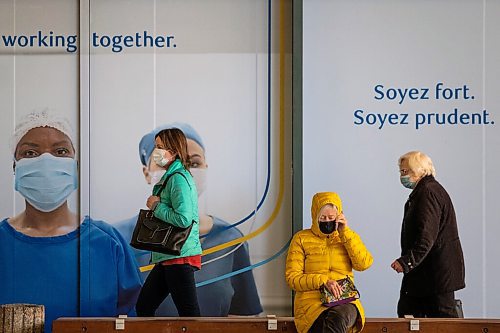 Daniel Crump / Winnipeg Free Press. People come and go from the RBC Convention Centre downtown as they get their COVID-19 vaccinations Wednesday afternoon. March 31, 2021.