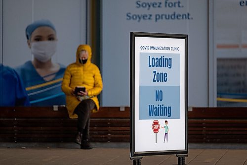 Daniel Crump / Winnipeg Free Press. A person waits outside the RBC Convention Centre downtown after receiving their  COVID-19 vaccination Wednesday afternoon. March 31, 2021.