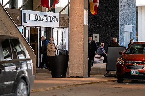 Daniel Crump / Winnipeg Free Press. People come and go from the RBC Convention Centre downtown as they get their COVID-19 vaccinations Wednesday afternoon. March 31, 2021.