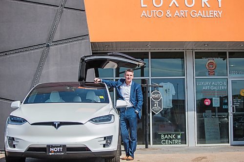 MIKAELA MACKENZIE / WINNIPEG FREE PRESS

Trevor Nott of Nott Auto poses with a Tesla at the car dealership in Winnipeg on Thursday, April 1, 2021. Nott has sold the first car in Manitoba using cryptocurrency (maybe the first in the country) and is about to do another. For Martin Cash story.

Winnipeg Free Press 2021